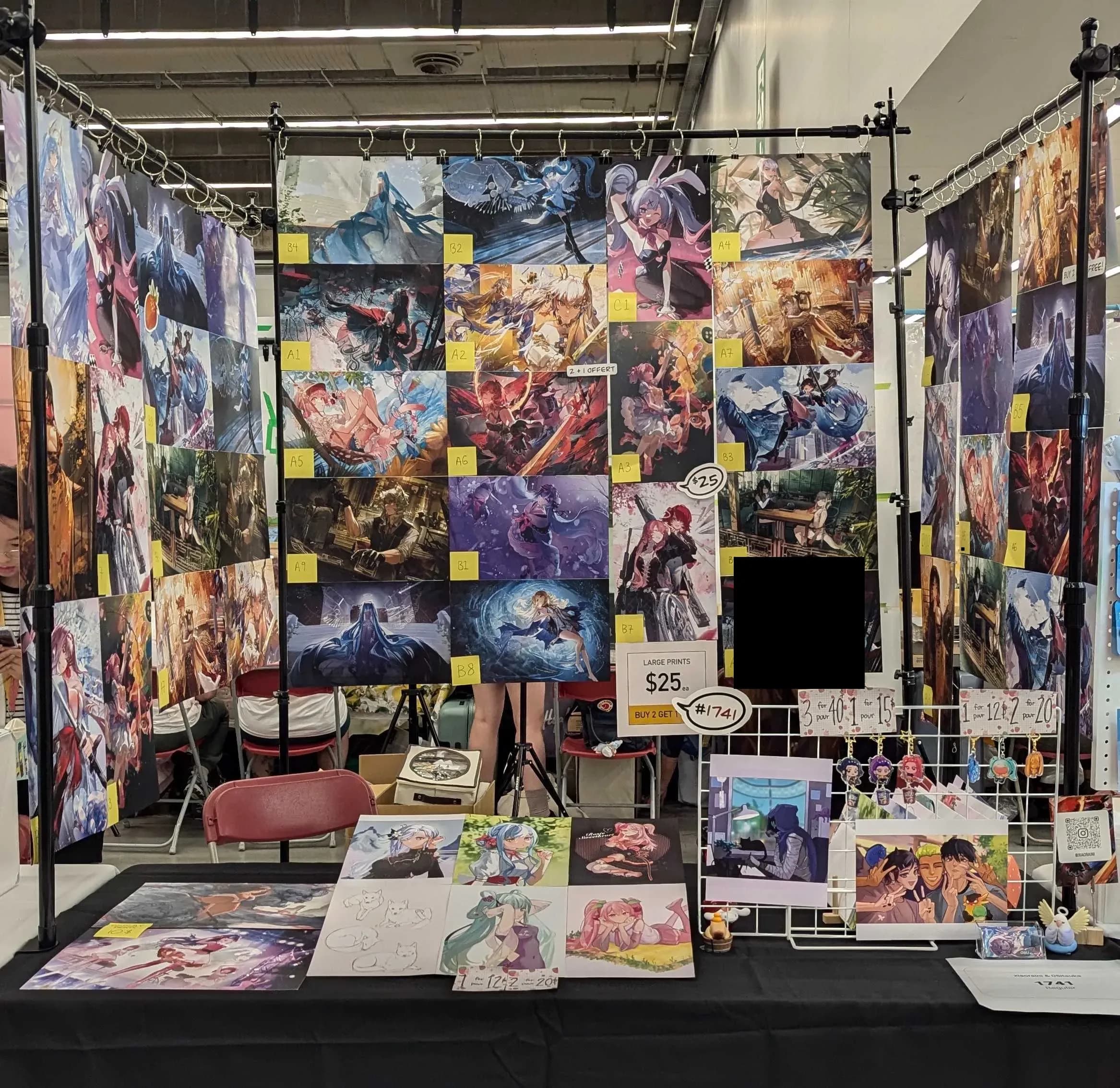 Convention table with charms and prints